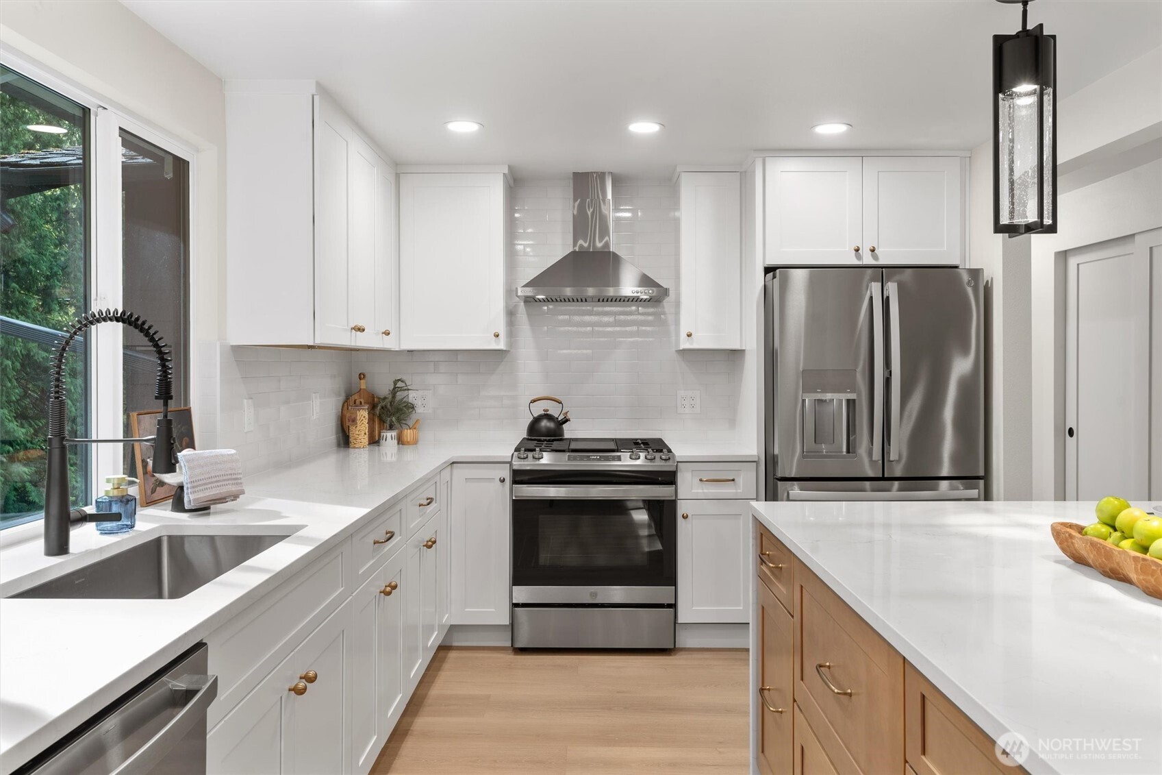 22929 38th Avenue Southeast Bothell, WA 98021 - Photo 9 of 37 a kitchen with stainless steel appliances granite countertop a sink stove and refrigerator