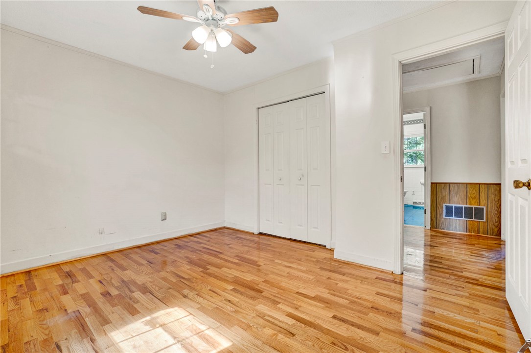 7876 Highway 11 Walhalla, SC 29691 - Photo 21 of 35 Hardwood floors and a ceiling fan create a comfortable atmosphere in this well-lit space.