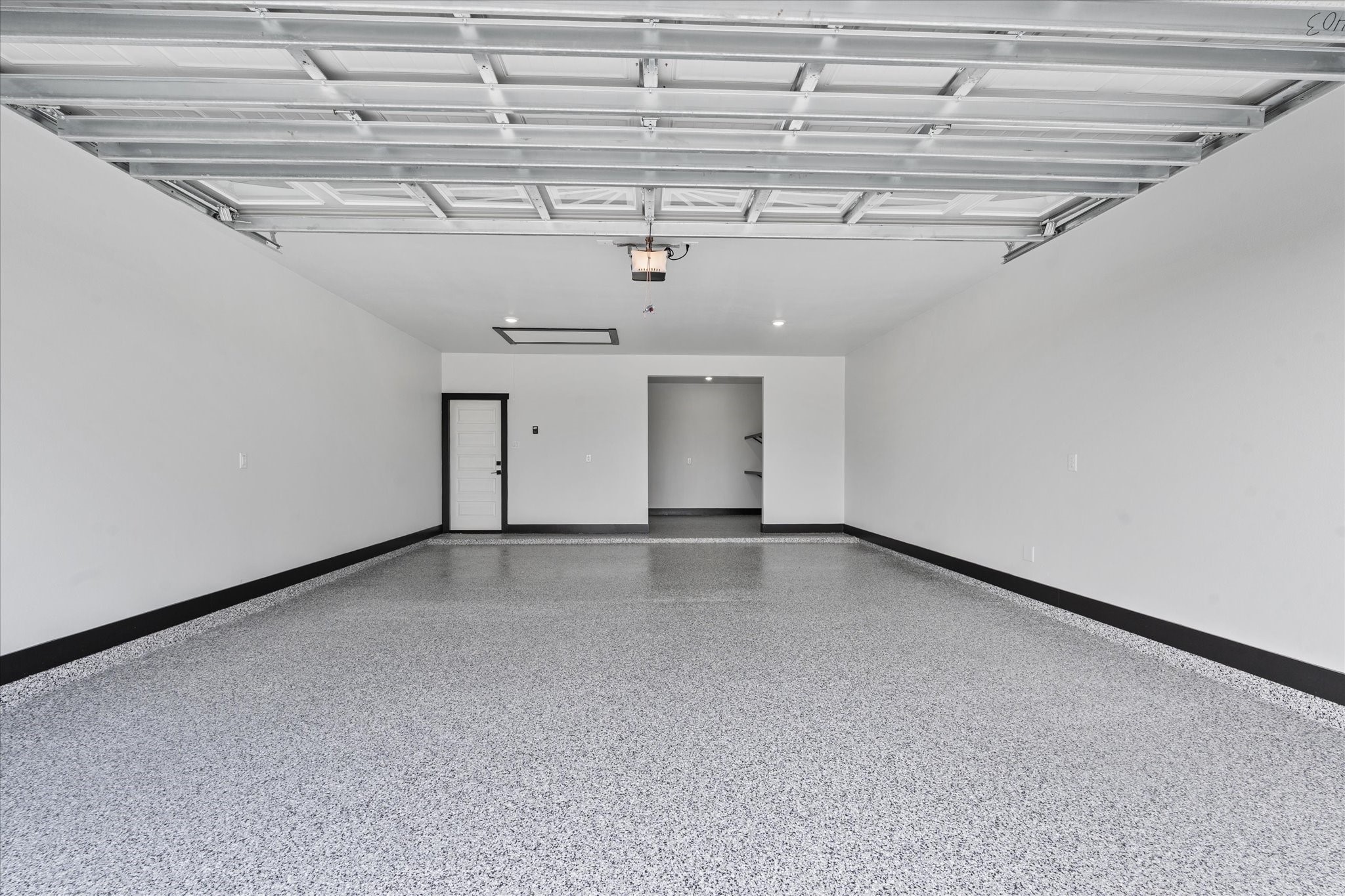 447 Sunset Trail Angleton, TX 77515 - Photo 29 of 41 Garage/Epoxy Floor/Extra Storage in back