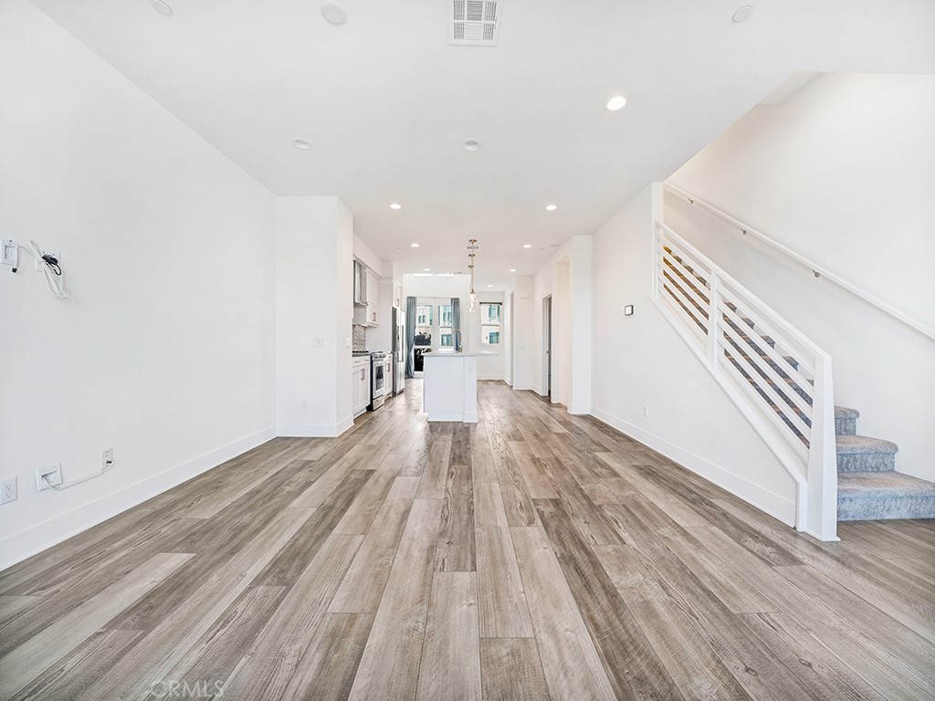 1658 Topanga Costa Mesa, CA 92627 - Photo 13 of 32 a view of a room with wooden floor