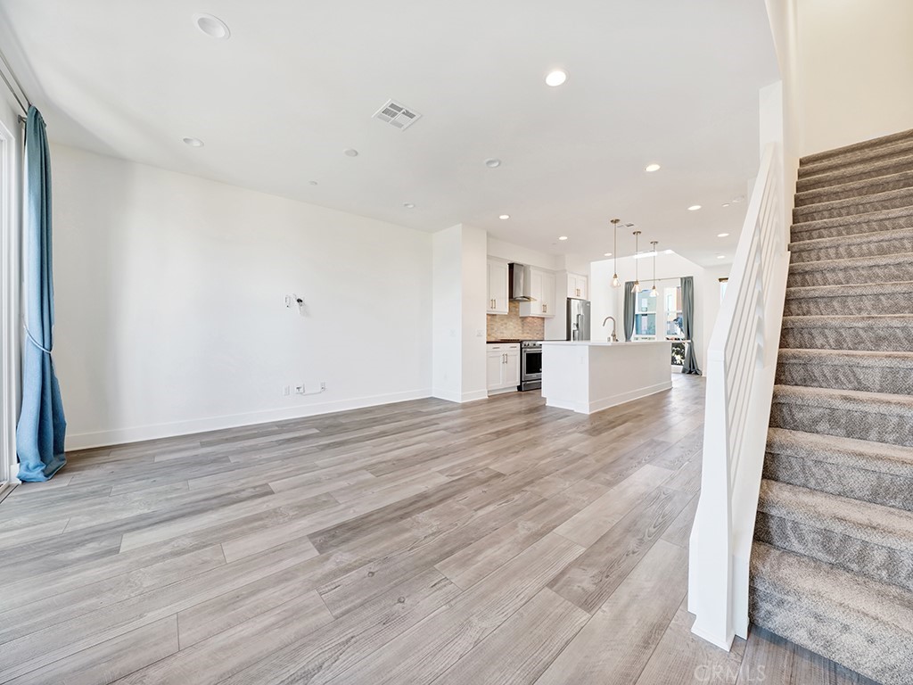 1658 Topanga Costa Mesa, CA 92627 - Photo 14 of 32 a view of kitchen and hall with wooden floor