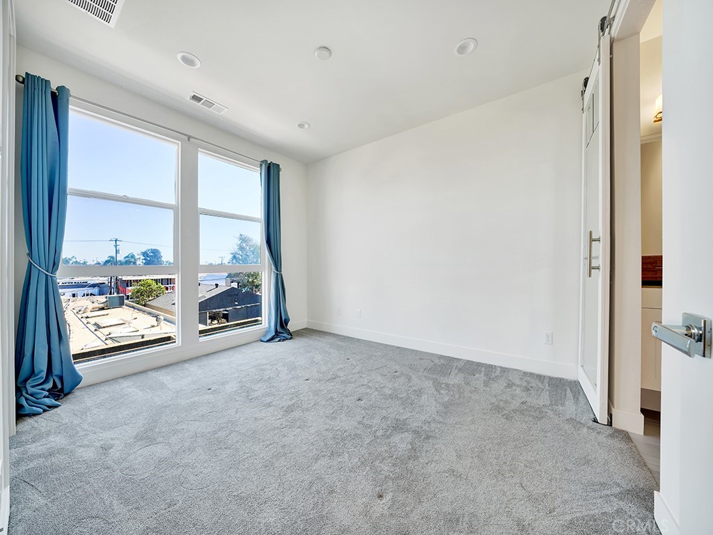 1658 Topanga Costa Mesa, CA 92627 - Photo 17 of 32 a view of an empty room with a window