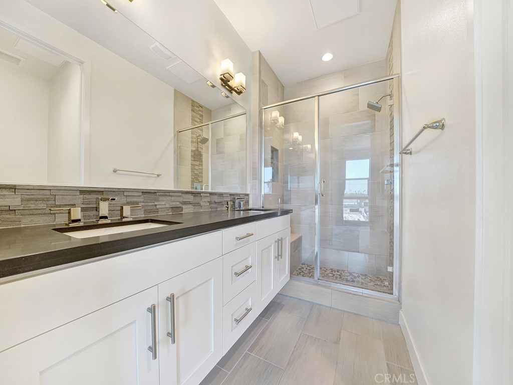 1658 Topanga Costa Mesa, CA 92627 - Photo 19 of 32 a bathroom with a sink and a mirror