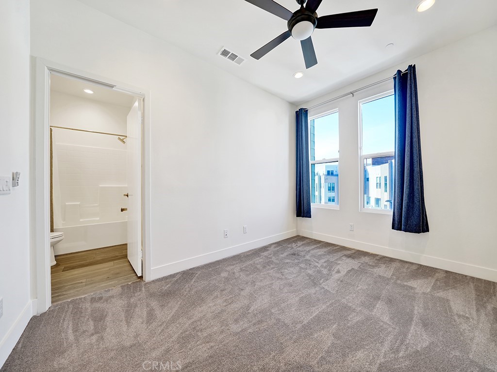 1658 Topanga Costa Mesa, CA 92627 - Photo 20 of 32 a view of an empty room and window and ceiling fan
