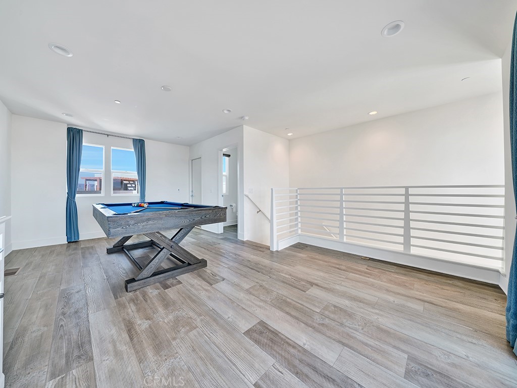 1658 Topanga Costa Mesa, CA 92627 - Photo 24 of 32 a view of a room with wooden floor and a window