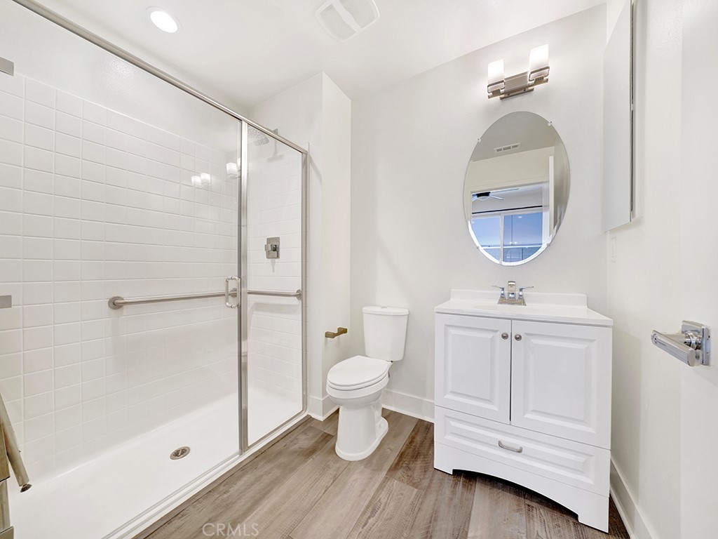 1658 Topanga Costa Mesa, CA 92627 - Photo 6 of 32 a bathroom with a toilet a sink and shower