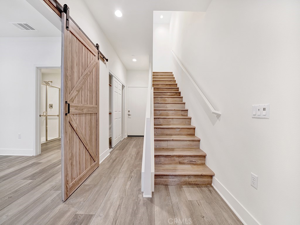 1658 Topanga Costa Mesa, CA 92627 - Photo 7 of 32 a view of entryway with wooden floor