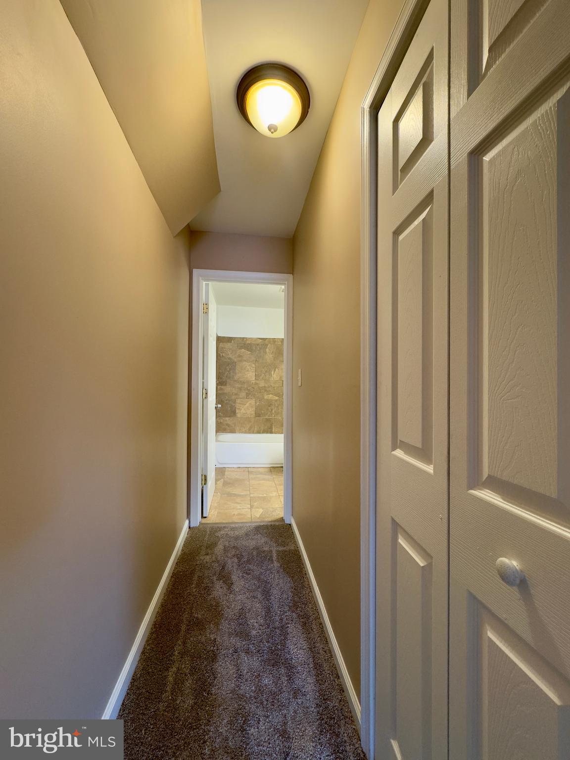 2033 Orleans Street Baltimore, MD 21231 - Photo 20 of 22 a view of a hallway with wooden floor and windows
