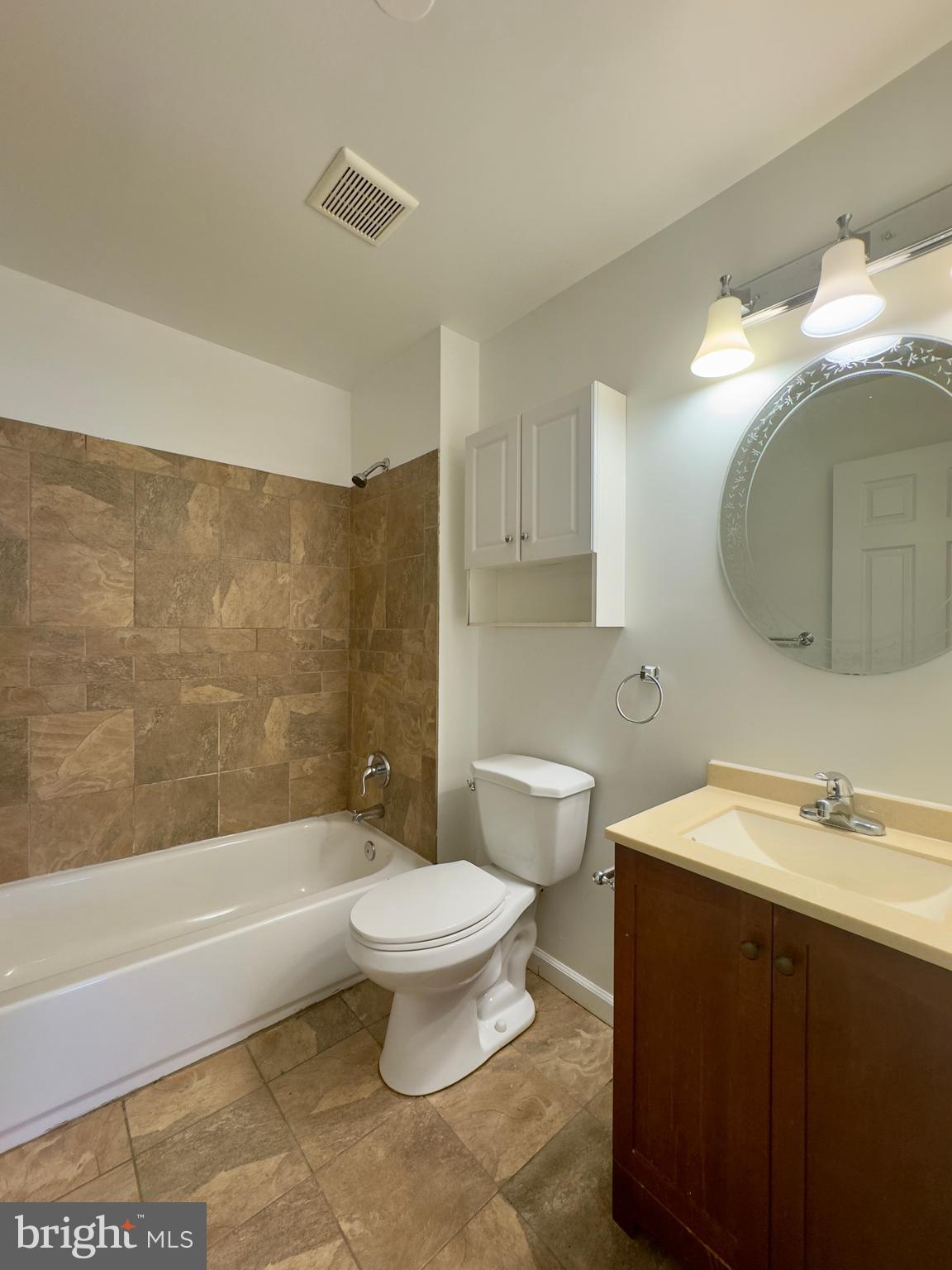 2033 Orleans Street Baltimore, MD 21231 - Photo 21 of 22 a bathroom with a sink a toilet and bathtub