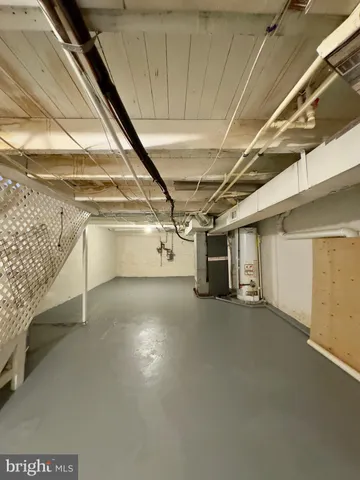 a view of a livingroom with a flat screen tv and wooden floor
