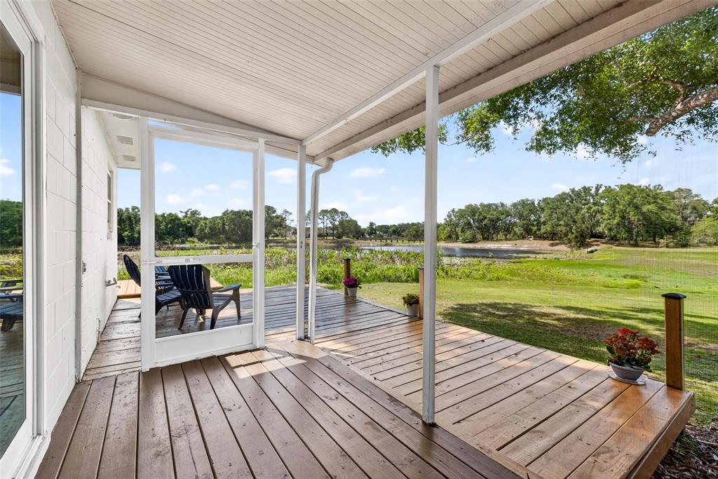 16330 Hanna Road Lutz, FL 33549 - Photo 29 of 41 a view of a balcony with lake view and a floor to ceiling window