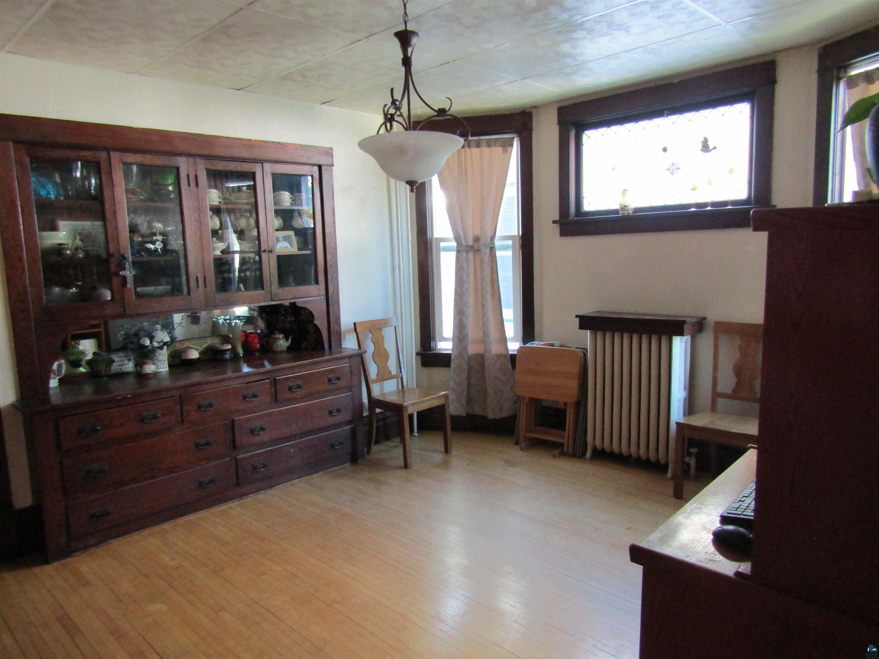 1115 Harrison Street Superior, WI 54880 - Photo 3 of 49 Built-in wood cabinetry with glass display doors and lower drawers