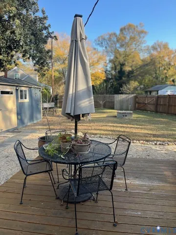 a view of a backyard with sitting area
