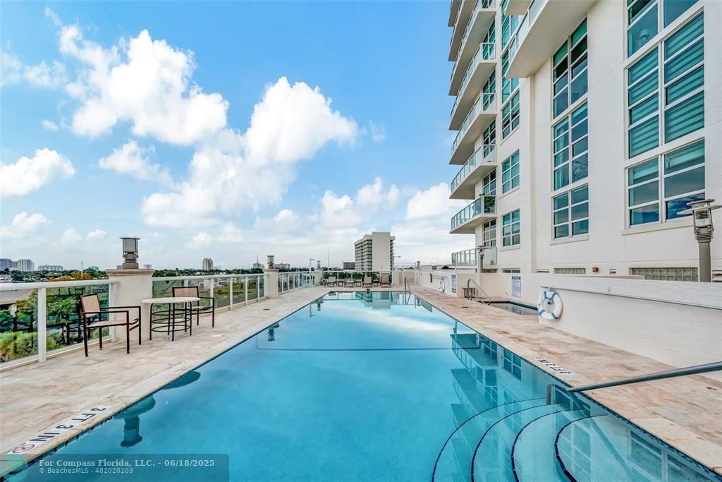1819 Southeast 17th Street, Unit 803 Fort Lauderdale, FL 33316 - Photo 17 of 20 a view of a swimming pool with outdoor seating