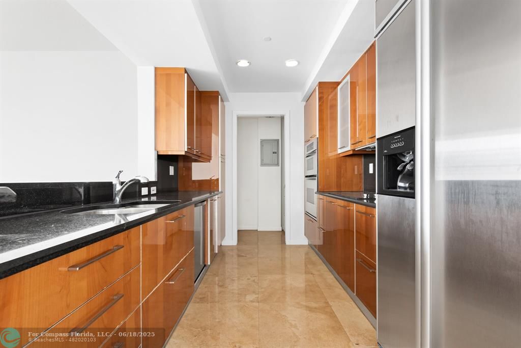 1819 Southeast 17th Street, Unit 803 Fort Lauderdale, FL 33316 - Photo 2 of 20 a large kitchen with stainless steel appliances granite countertop a refrigerator and a sink