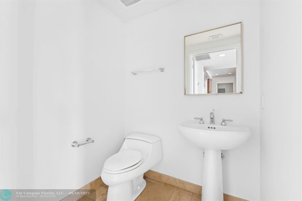 1819 Southeast 17th Street, Unit 803 Fort Lauderdale, FL 33316 - Photo 7 of 20 a bathroom with a sink toilet and mirror