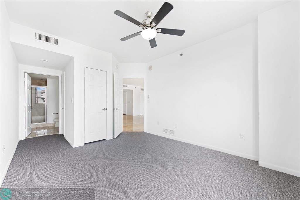 1819 Southeast 17th Street, Unit 803 Fort Lauderdale, FL 33316 - Photo 8 of 20 an empty room with closet and windows