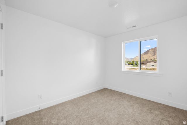 1510 West 600 North, Unit 4A Mapleton, UT 84664 - Photo 17 of 23 Unfurnished room with light colored carpet and a mountain view