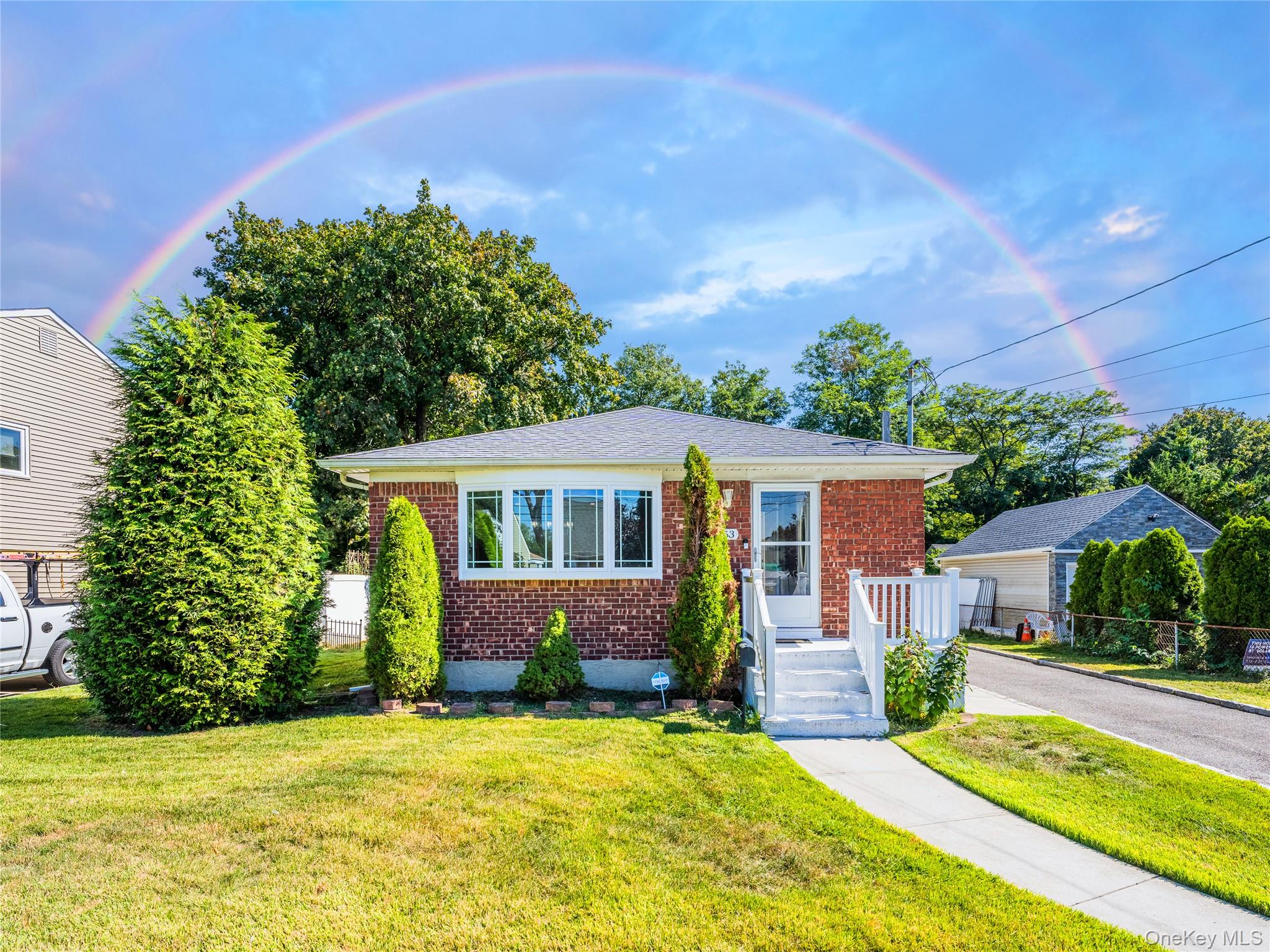 View of front of property with brick siding