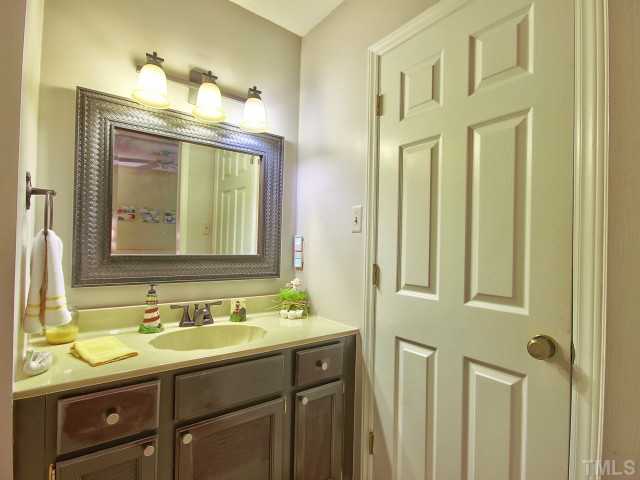 5600 Hamstead Crossing Raleigh, NC 27612 - Photo 13 of 25 Your master bath has a separate shower with tub, vanity and upgraded lighting and plumbing fixtures.