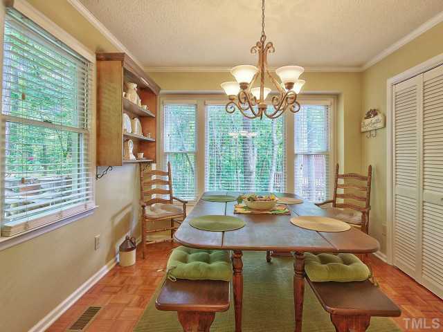 5600 Hamstead Crossing Raleigh, NC 27612 - Photo 7 of 25 Your dining room has lots of windows for natural light, access to the laundry closet and opens up to your deck.