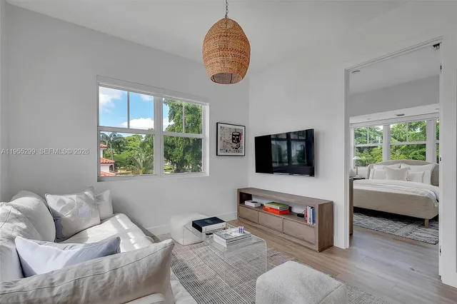 a living room with furniture and a flat screen tv