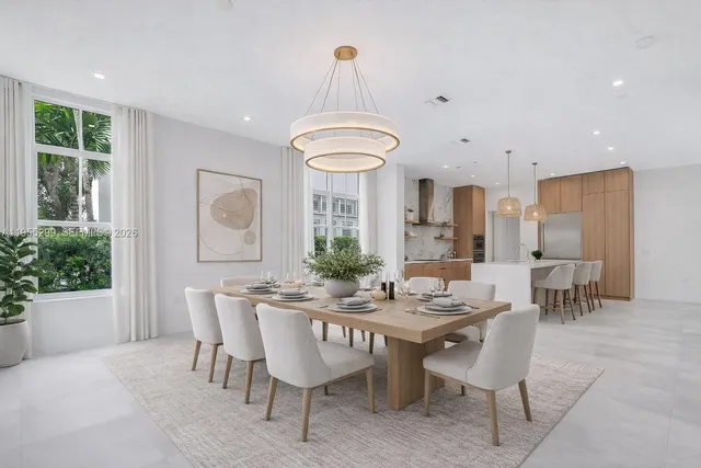 a view of a dining room with furniture and window