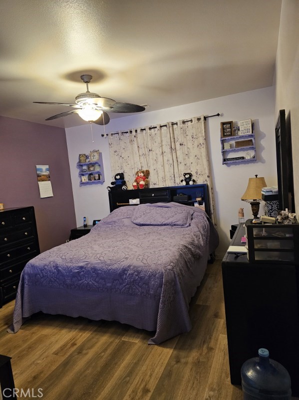 11847 Branch Court Adelanto, CA 92301 - Photo 11 of 18 a bedroom with a bed and a flat screen tv