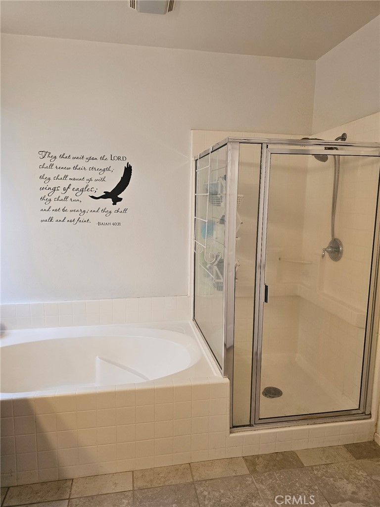 11847 Branch Court Adelanto, CA 92301 - Photo 15 of 18 a bathroom with a bathtub and a shower