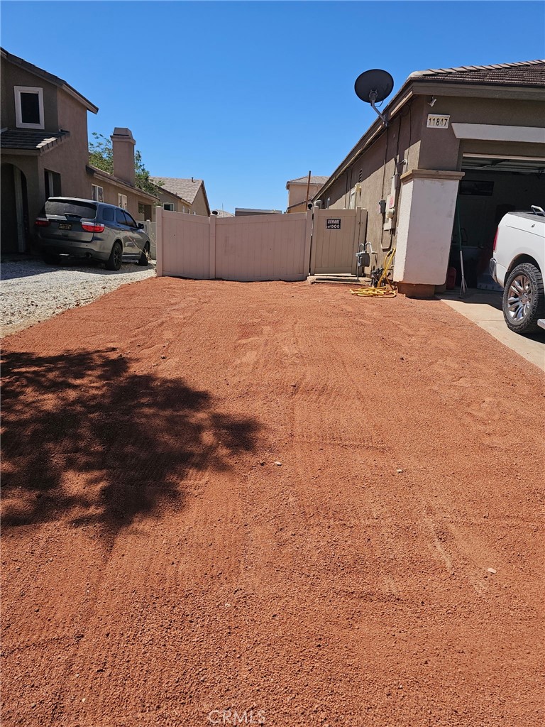 11847 Branch Court Adelanto, CA 92301 - Photo 16 of 18 a view of a car park in front of house