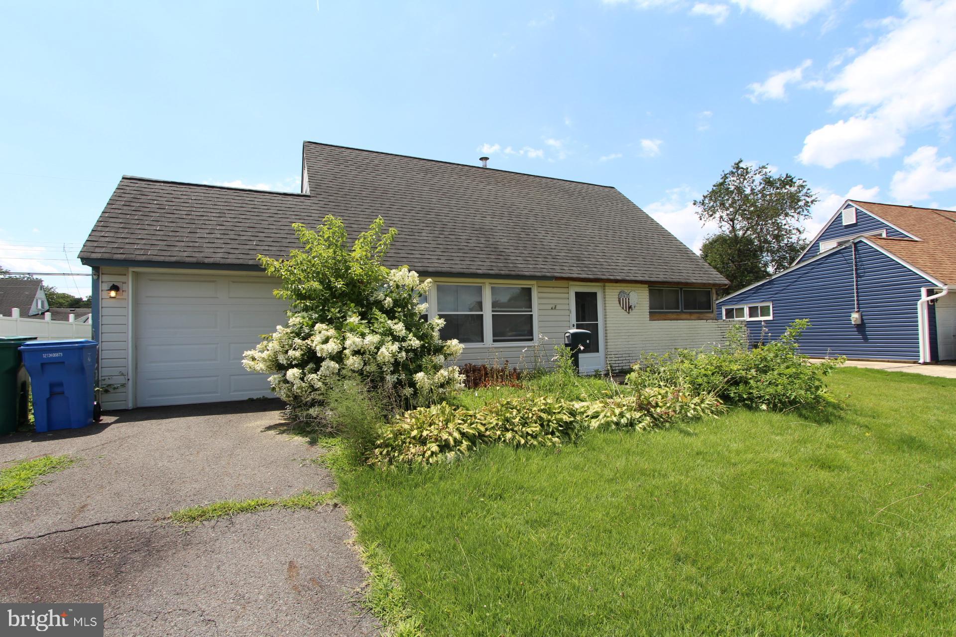 41 Jewel Lane Levittown, PA 19055 - Photo 1 of 24 a front view of a house with a garden