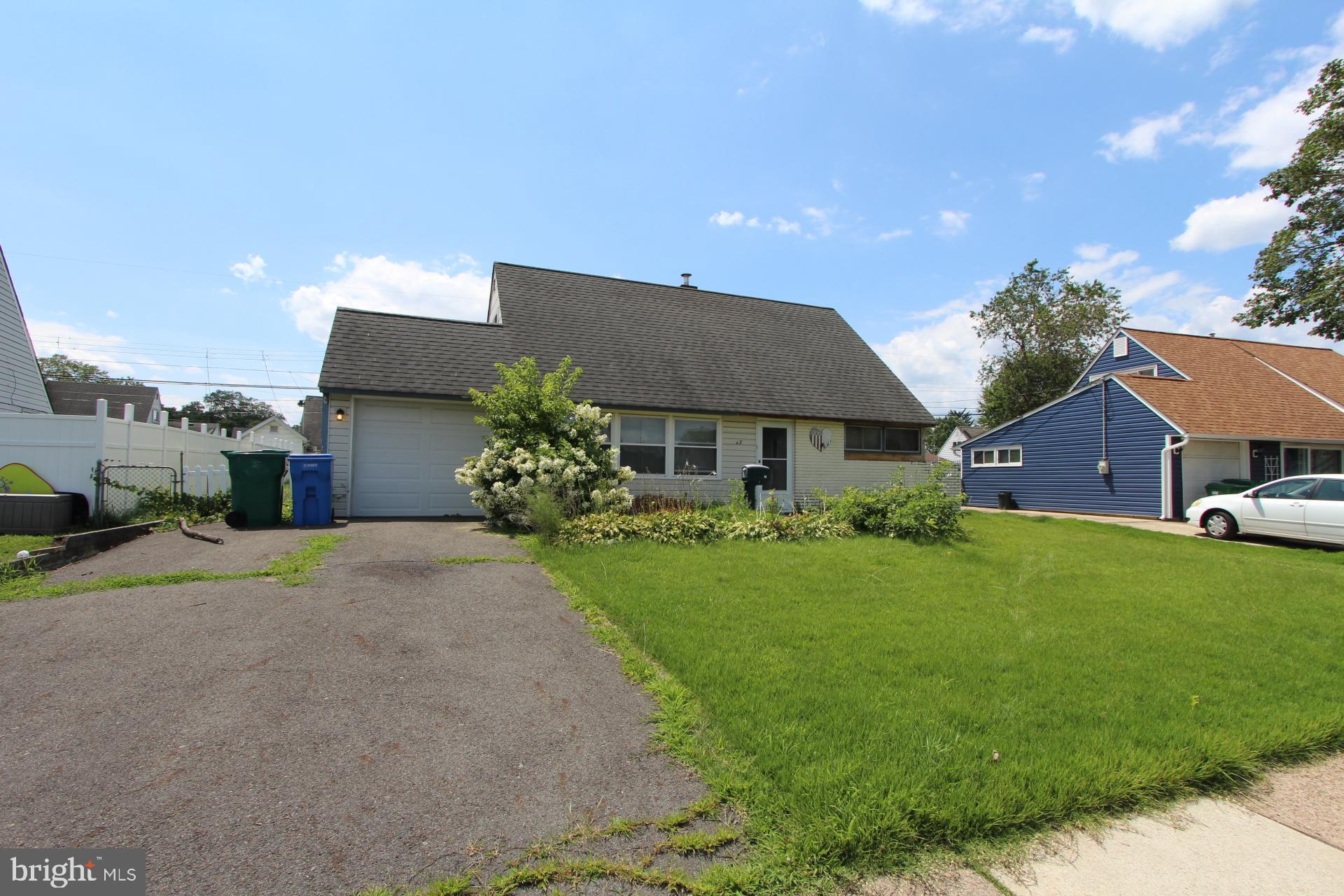 41 Jewel Lane Levittown, PA 19055 - Photo 2 of 24 a front view of house with yard and trees