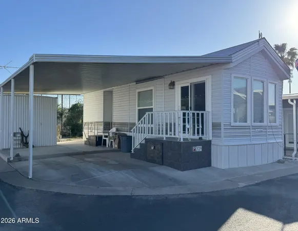 a view of house with car parked
