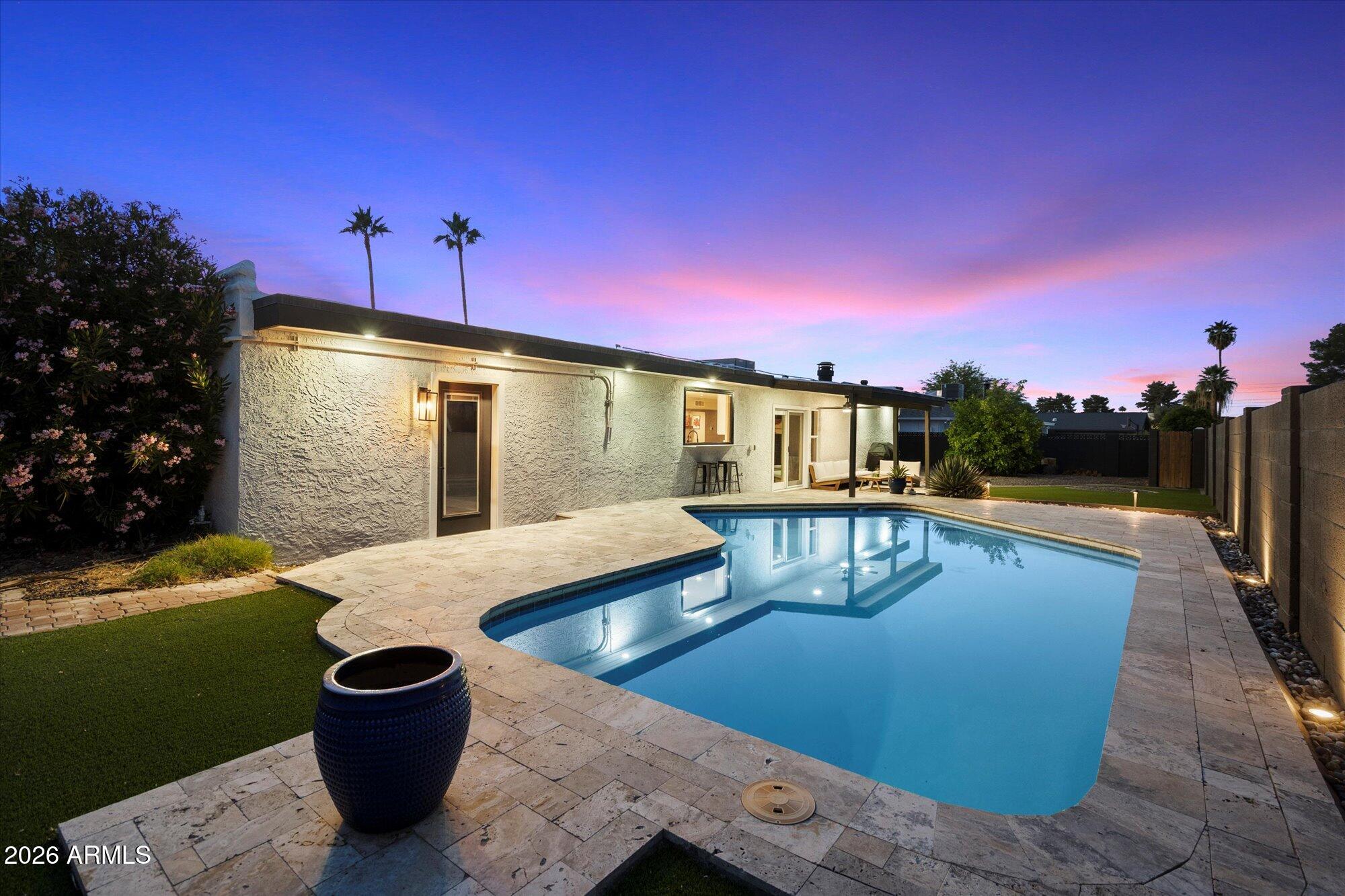 10245 North 34th Place Phoenix, AZ 85028 - Photo 19 of 26 a view of a swimming pool with a patio