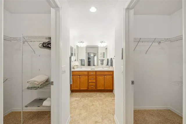 a bathroom with a tub shower sink and mirror
