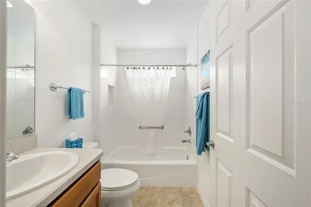 a bathroom with a sink a toilet and a bathtub