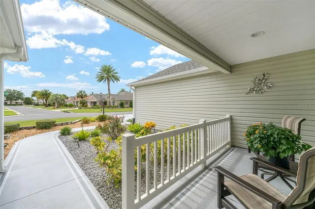 a view of a patio with wooden floor