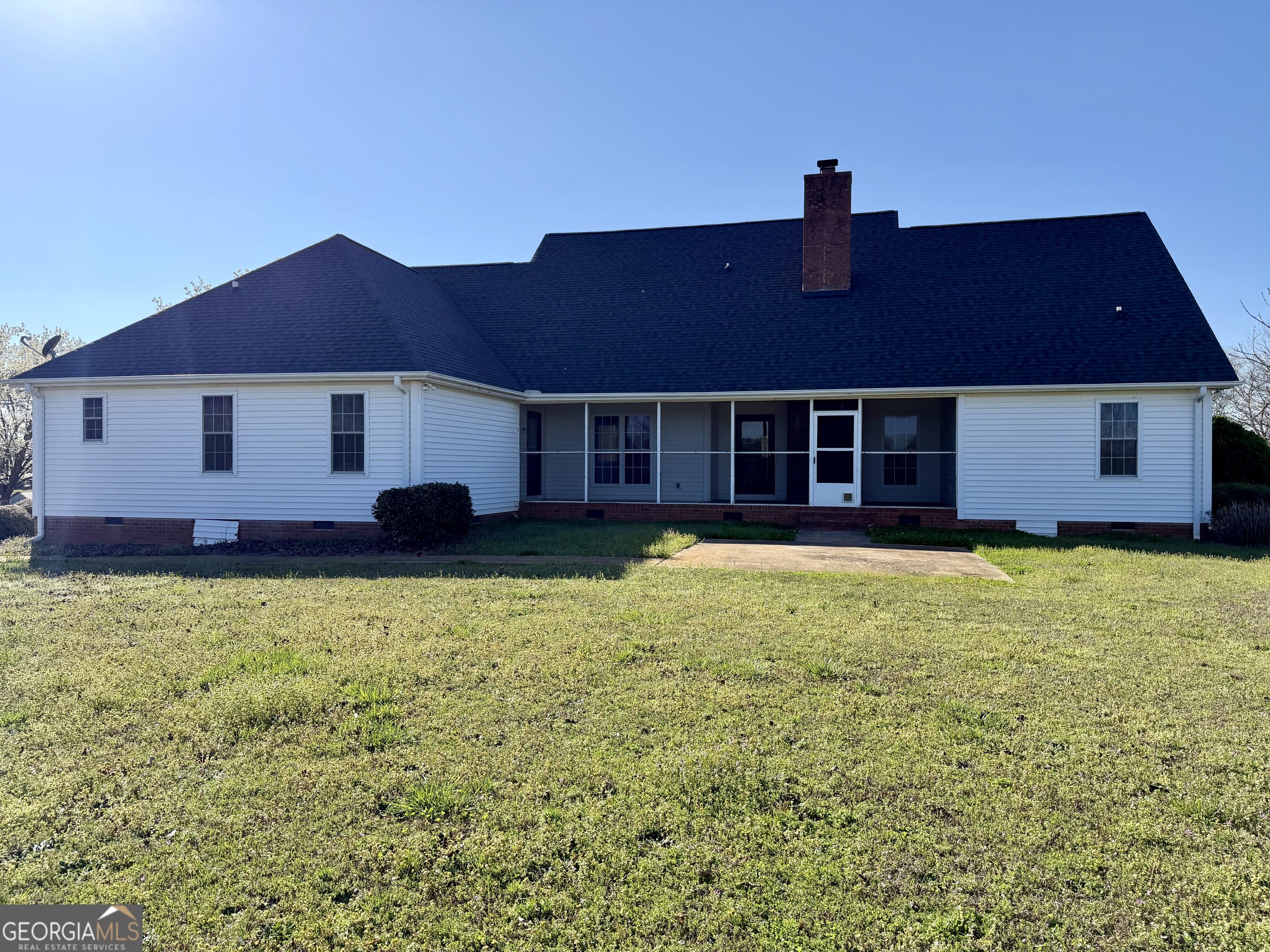 494 Broad Street Bowman, GA 30624 - Photo 10 of 65 a front view of a house with a garden