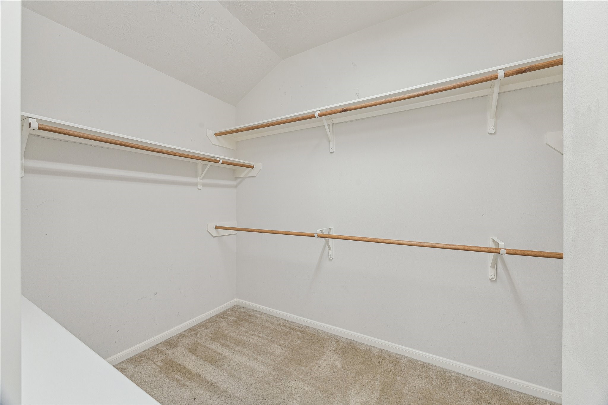 15203 Knotty Chestnut Street Cypress, TX 77429 - Photo 18 of 32 A large walk-in closet is accessed directly from within the primary bath.