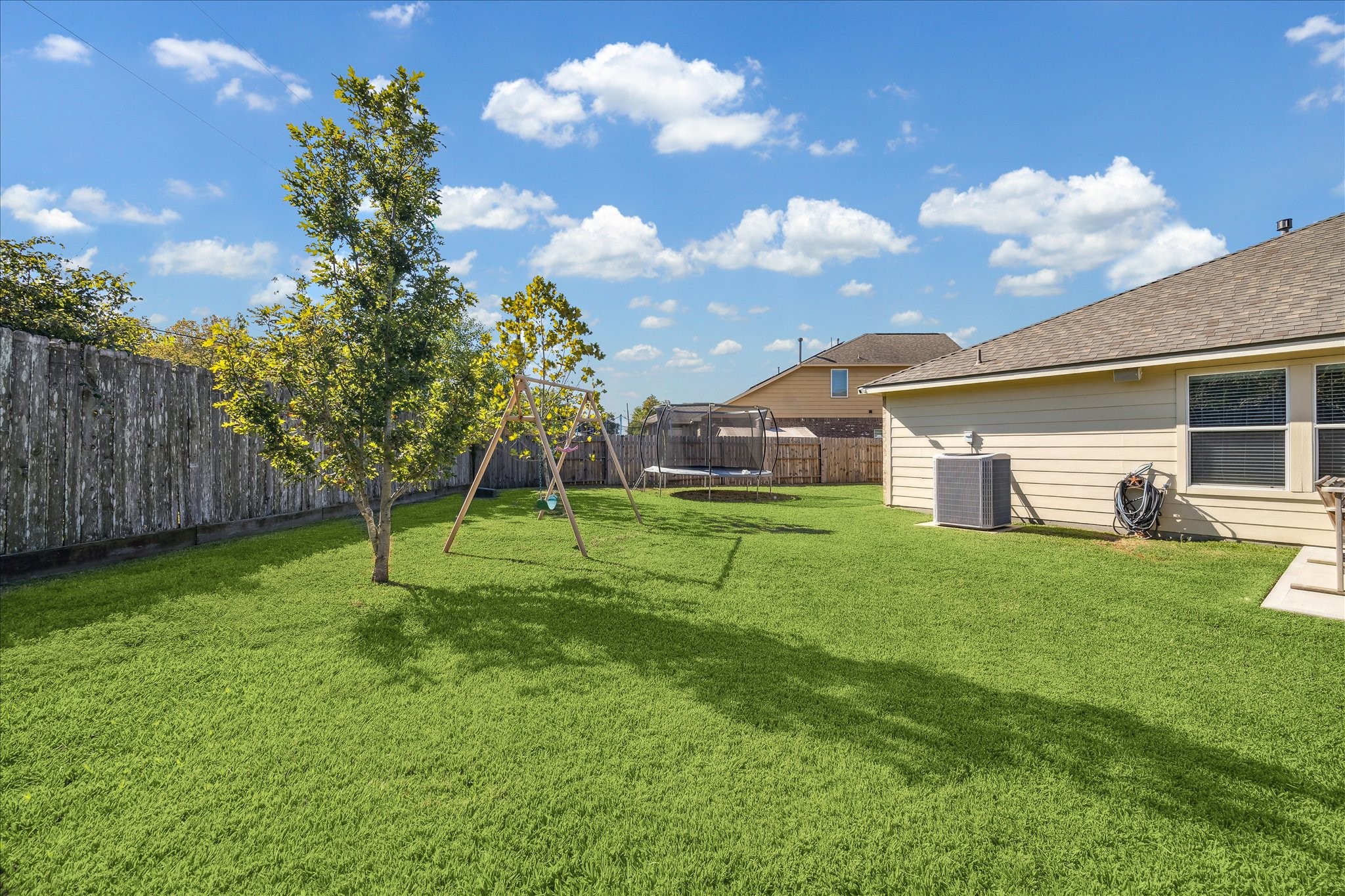 15203 Knotty Chestnut Street Cypress, TX 77429 - Photo 28 of 32 A view across the backyard toward the large side yard.