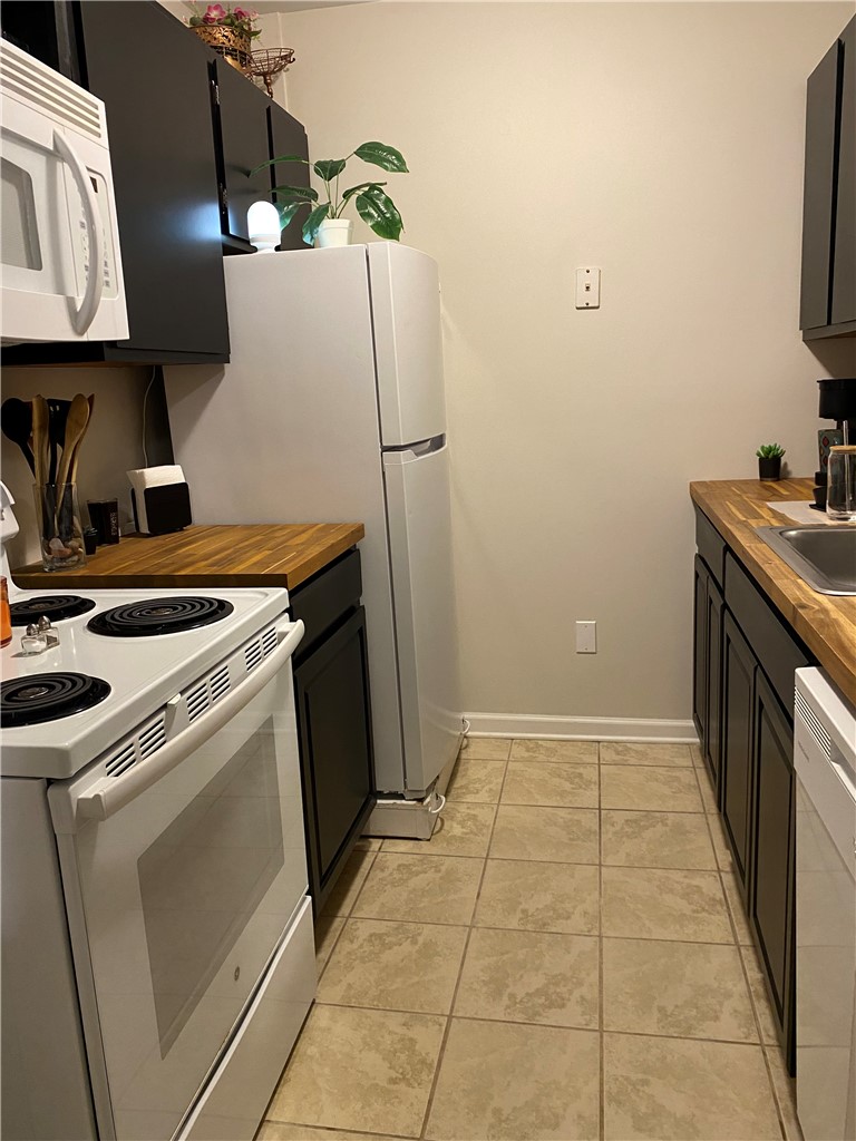 125 Maple Street, Unit 110 Pendleton, SC 29670 - Photo 11 of 22 Functional kitchen with ample cabinet space and durable flooring.