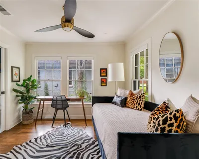 a living room with furniture or couch and a potted plant