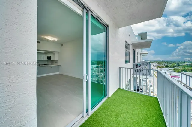 a view of a porch and garden
