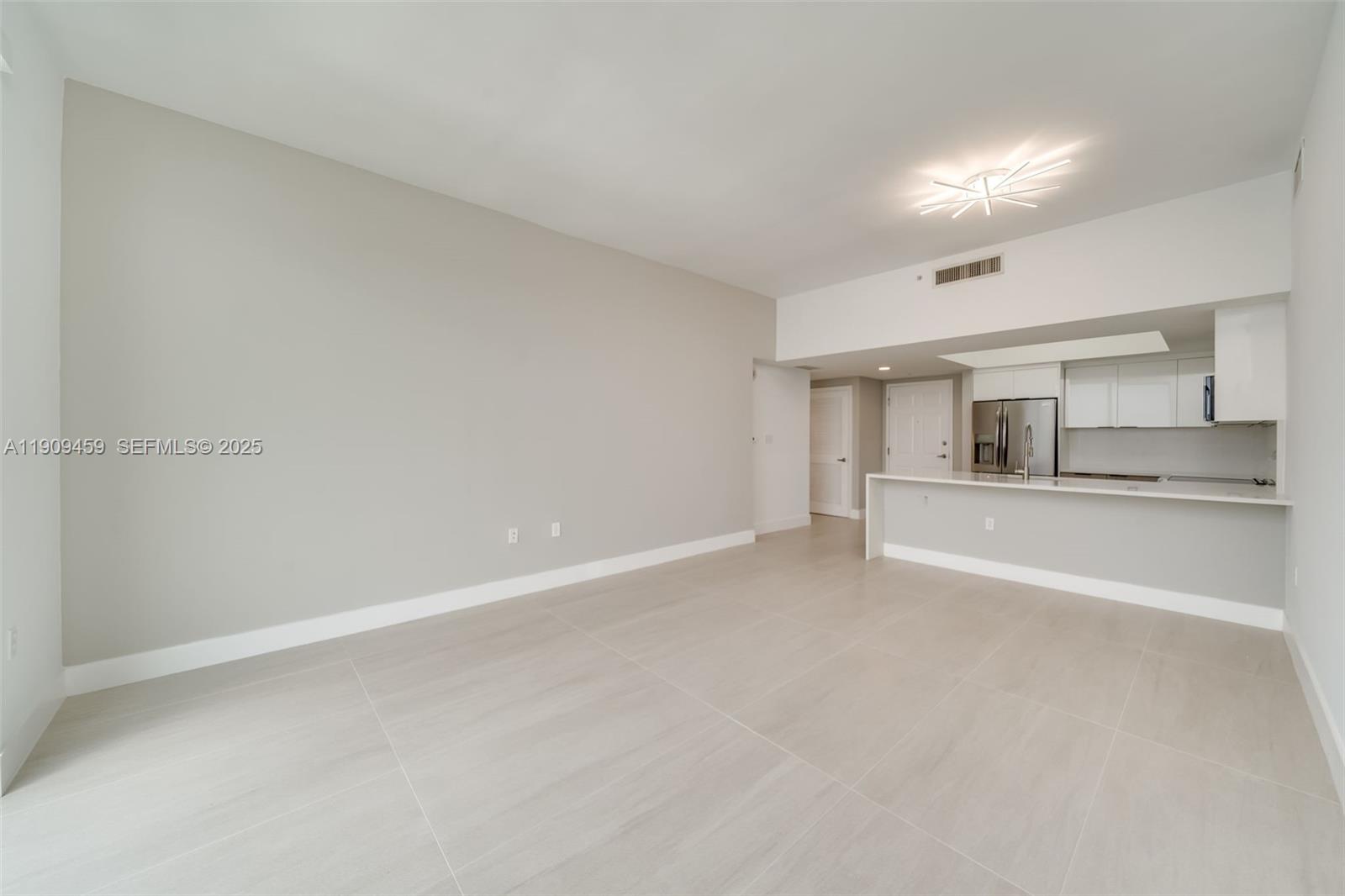 140 South Dixie Highway, Unit 1007 Hollywood, FL 33020 - Photo 13 of 32 a view of an empty room with window