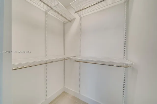 a view of an empty walk in closet