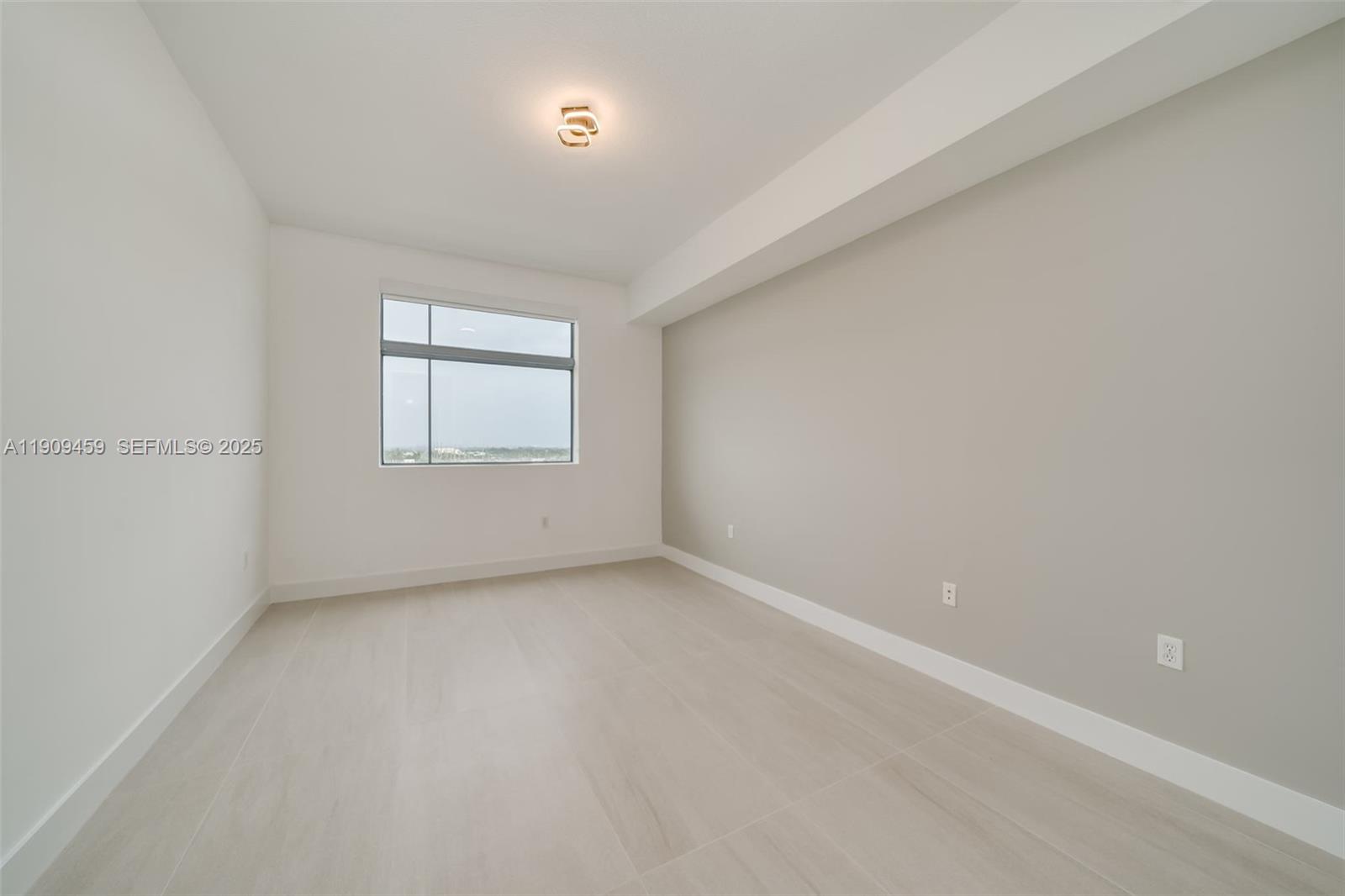 140 South Dixie Highway, Unit 1007 Hollywood, FL 33020 - Photo 26 of 32 an empty room with windows