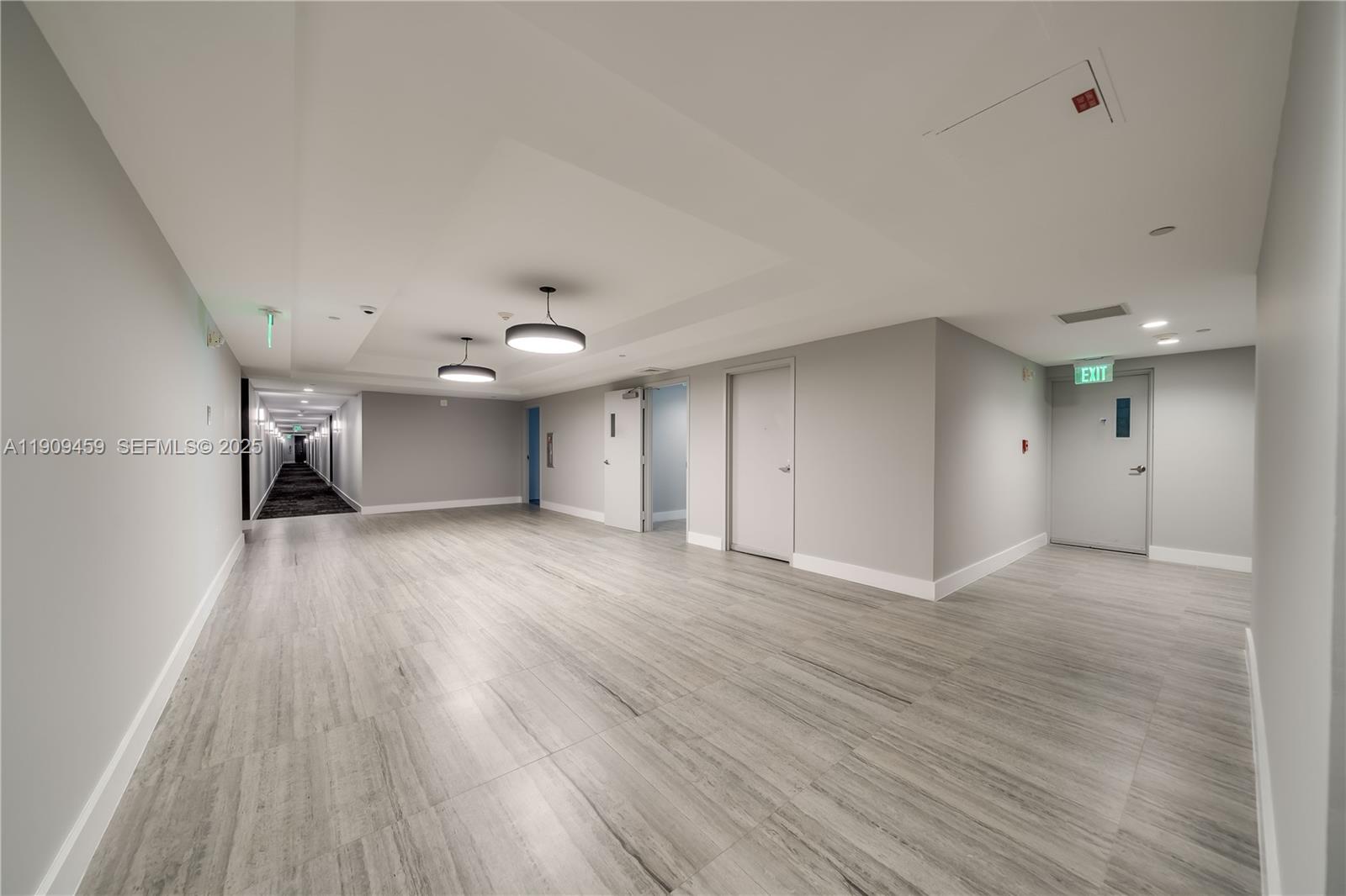 140 South Dixie Highway, Unit 1007 Hollywood, FL 33020 - Photo 27 of 32 wooden floor in an empty room with a window
