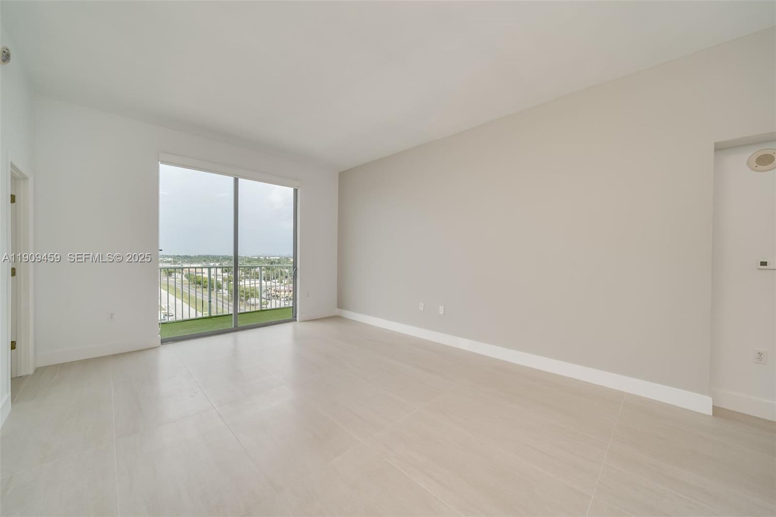 140 South Dixie Highway, Unit 1007 Hollywood, FL 33020 - Photo 8 of 32 an empty room with large windows