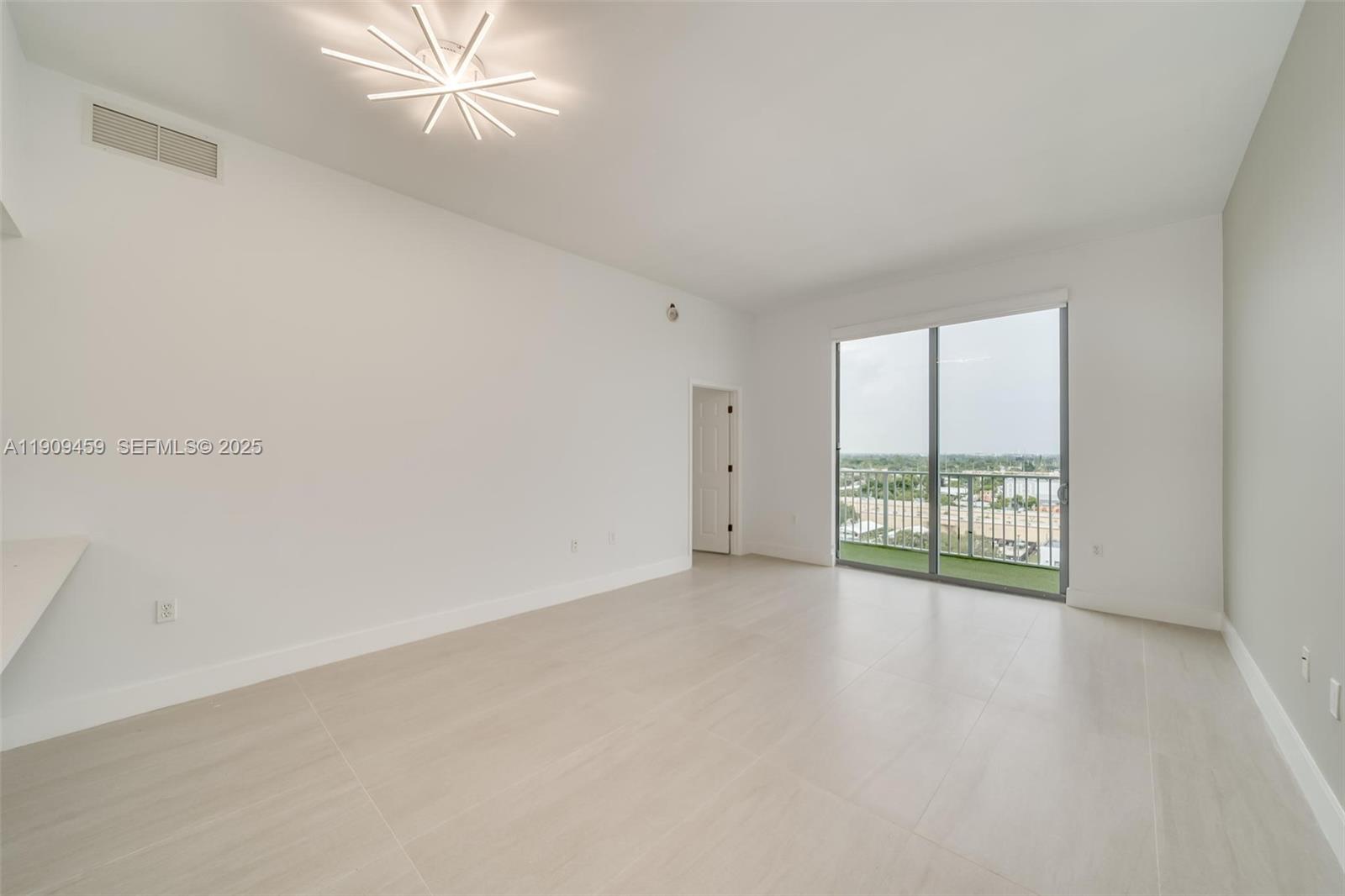 140 South Dixie Highway, Unit 1007 Hollywood, FL 33020 - Photo 9 of 32 wooden floor in an empty room with a window