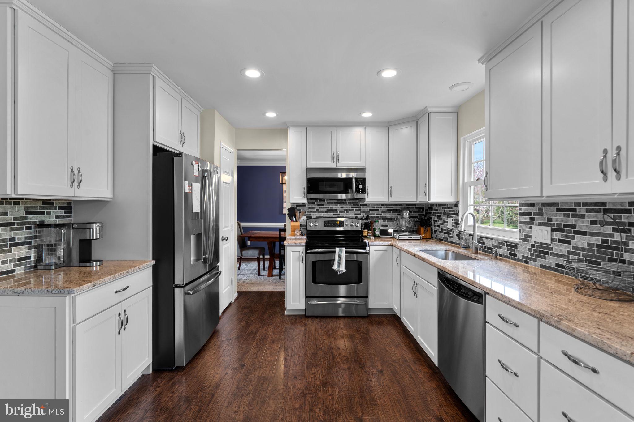 20747 Laplume Place Ashburn, VA 20147 - Photo 12 of 48 Stone counters and recessed lighting